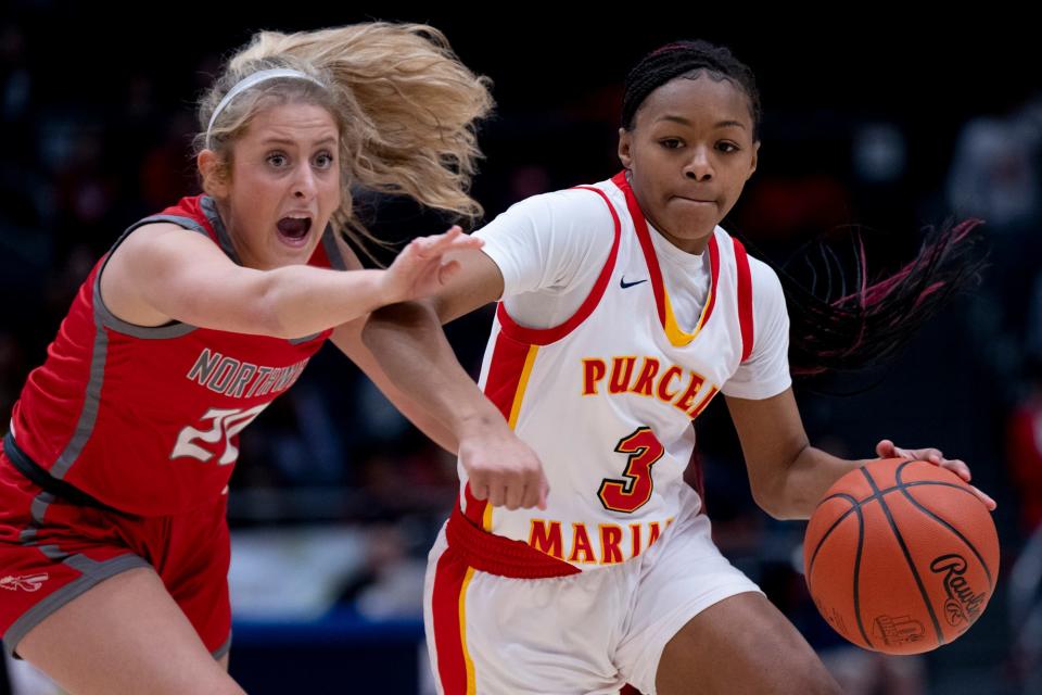 Purcell Marian guard Ky'Aira Miller (3) has 386 career assists in three years.