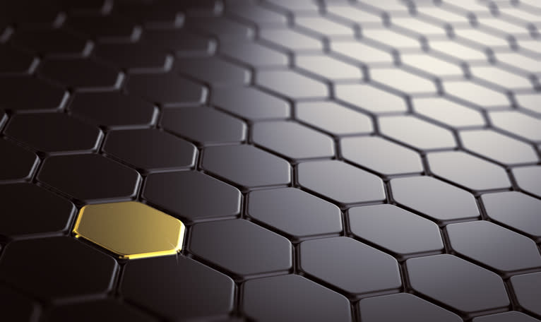 A gold tile among many black tiles.