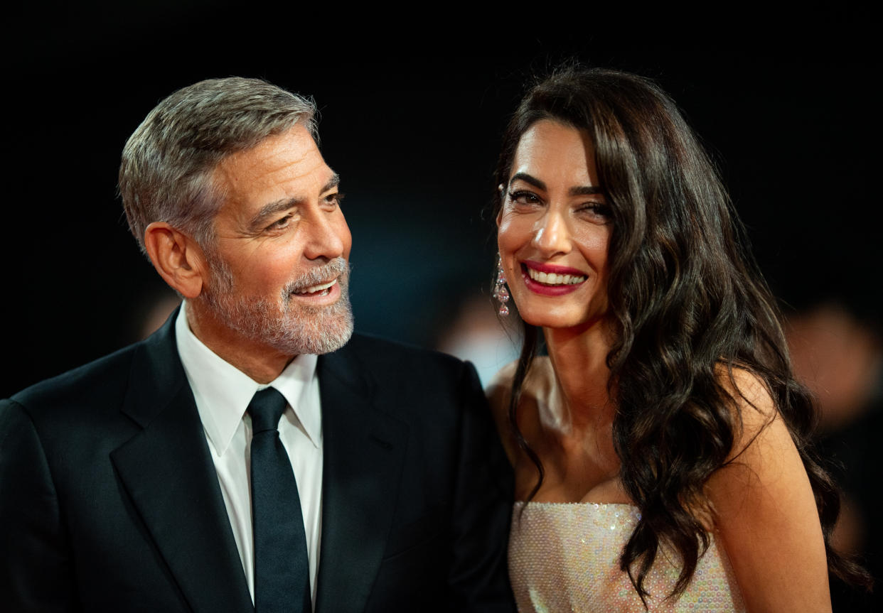 LONDON, ENGLAND - OCTOBER 10: George Clooney and Amal Clooney attend 