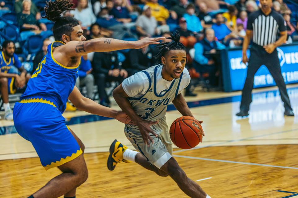 Oklahoma Wesleyan's Derrick Talton Jr. beats the defender and drives to the basket during a men's basketball game early in the 2022-23 season against Bethany.