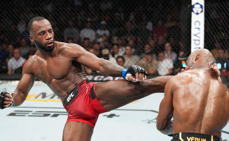 SALT LAKE CITY, UTAH - AUGUST 20: (L-R) Leon Edwards of Jamaica lands a head kick to Kamaru Usman of Nigeria in the UFC welterweight championship fight during the UFC 278 event at Vivint Arena on August 20, 2022 in Salt Lake City, Utah. (Photo by Josh Hedges/Zuffa LLC)