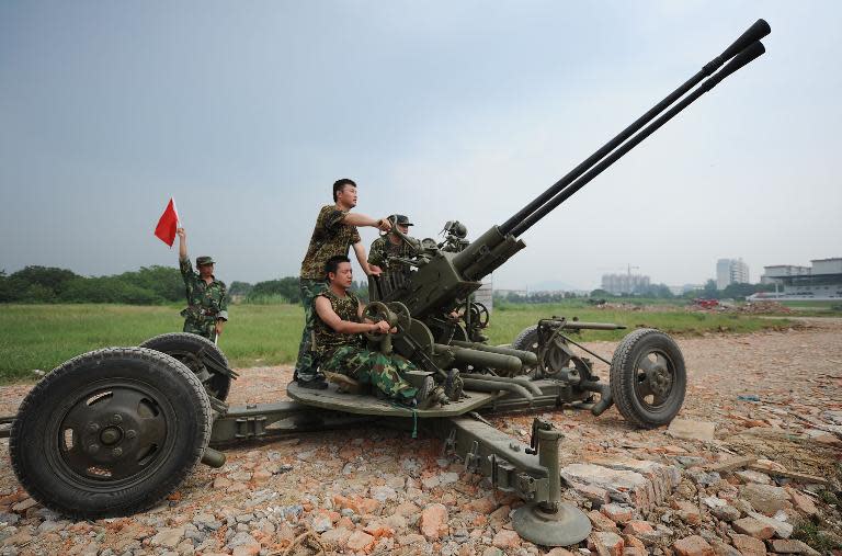 Chinese People's Liberation Army (PLA) soldiers take part in a drill at a military base in Hefei, in eastern China's Anhui province, July 26, 2011