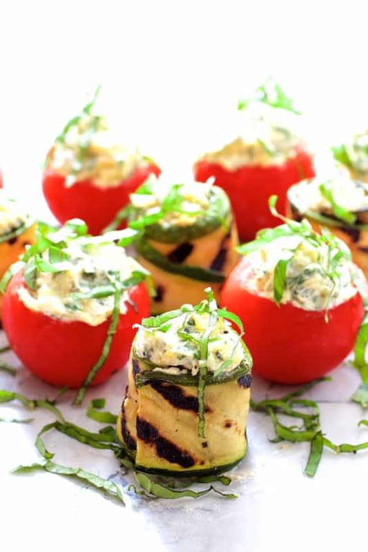 <p>From A Chef's Kitchen</p><p>Stuffed tomatoes are such a classic party food.</p><p><strong>Get the recipe: <a href="https://www.fromachefskitchen.com/cream-cheese-artichoke-stuffed-tomatoes-zucchini/" rel="nofollow noopener" target="_blank" data-ylk="slk:Cream Cheese and Artichoke-Stuffed Tomatoes and Grilled Zucchini;elm:context_link;itc:0;sec:content-canvas" class="link ">Cream Cheese and Artichoke-Stuffed Tomatoes and Grilled Zucchini</a></strong></p>