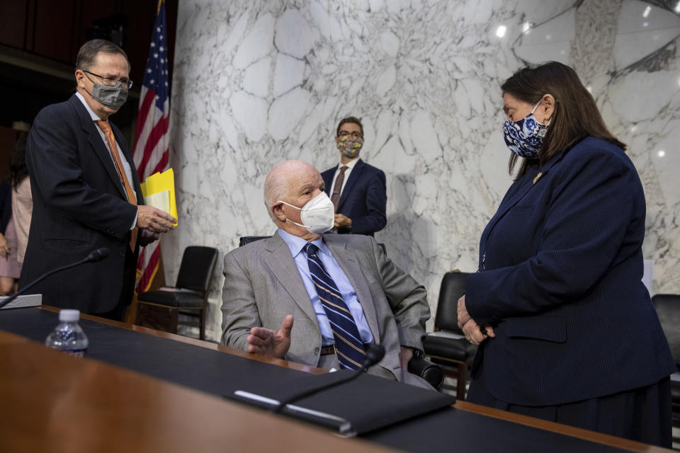 Sen. Jim Risch, R-Idaho, right, speaks to Sen. Bob Menendez, D-N.J., left, before a Senate Foreign Relations Committee meeting on Capitol Hill in Washington, Wednesday, Aug. 4, 2021. (AP Photo/Amanda Andrade-Rhoades)