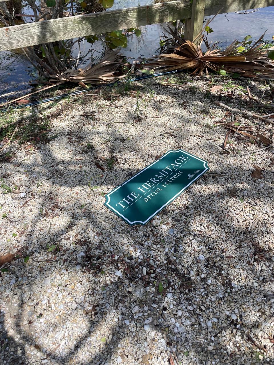 A sign for the Hermitage Artist Retreat was knocked off its post during Hurricane Ian.