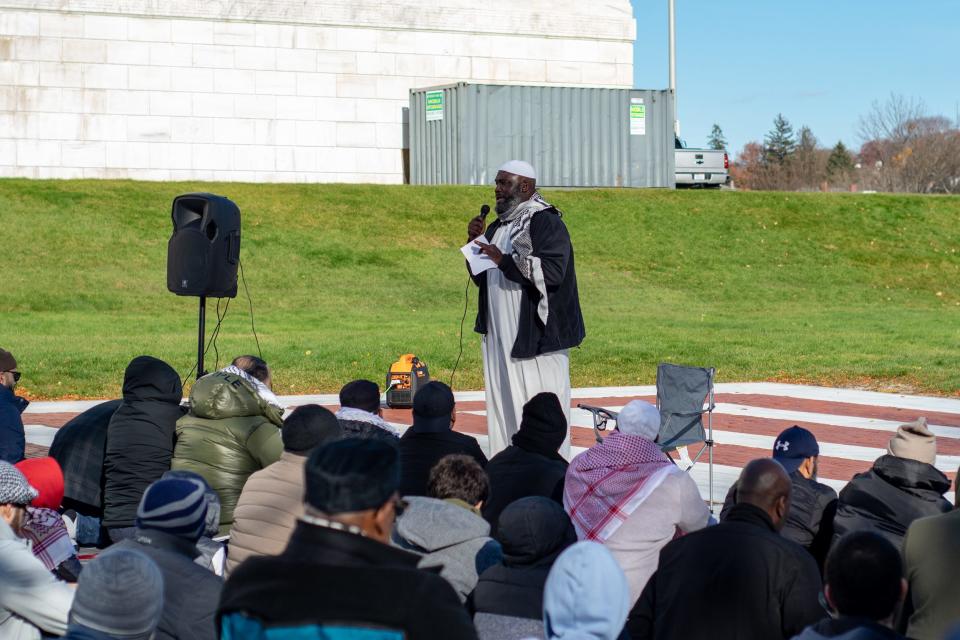 Imam Abdul-Latif Sackor of the Islamic Center of Rhode Island addresses a crowd after prayer and before a march on the Providence Place mall, demonstrating against the Israeli occupation of the Gaza Strip and the West Bank.