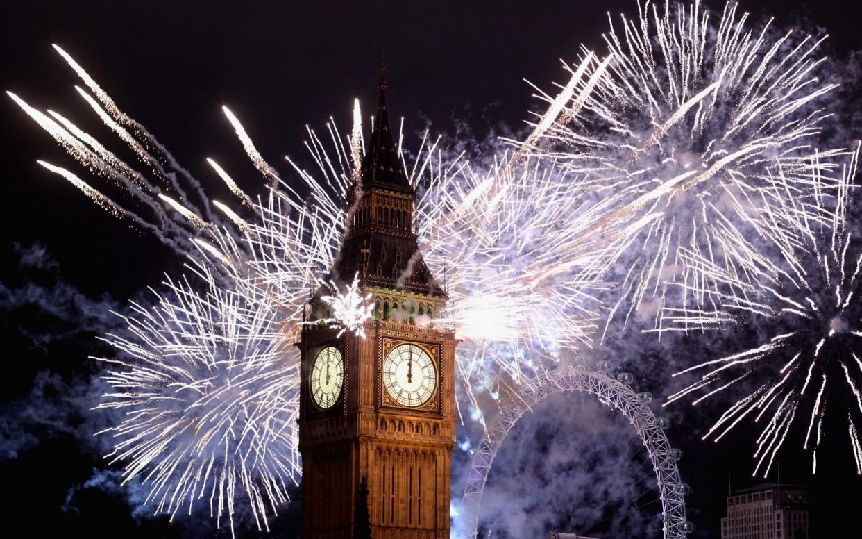 Fireworks light up the London skyline and Big Ben just after midnight on January 1, 2012 - Getty Images