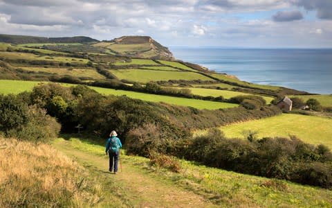 Walker near Stonebarrow - Credit: Getty