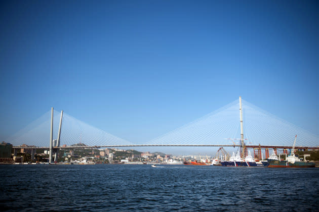 General view taken on June 26, 2012 show the cable-stayed Golden Horn bridge over the Golden Horn bay in Vladivostok. French company Freyssinet, a subsidiary of VINCI, world leader in prestressing and cable staysdesigned, supplied and installed 192 stay cables for the 1389m lenght Golden Horn Bridge. AFP PHOTO MARTIN BUREAU