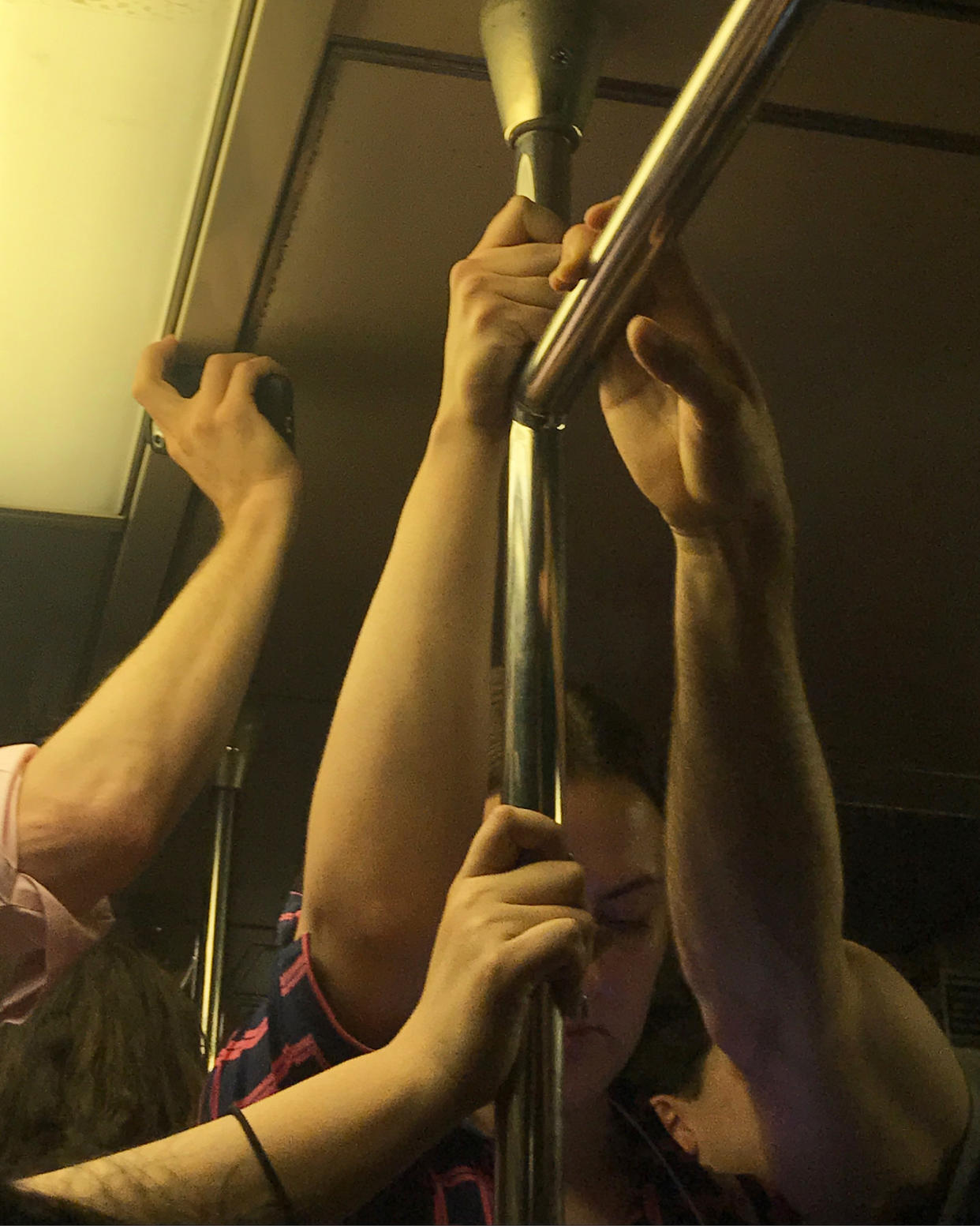 People on a crowded subway before the covid-19 pandemic.