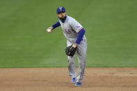 Texas Rangers' Isiah Kiner-Falefa throws to first after fielding a ball hit by Minnesota Twins' Kyle Garlick, who was out during the second inning of a baseball game Wednesday, May 5, 2021, in Minneapolis. (AP Photo/Stacy Bengs)