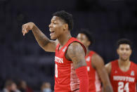 Houston guard Marcus Sasser (0) reacts after making a three-point shot against Texas Tech during the first half of an NCAA college basketball game, Sunday, Nov. 29, 2020, in Fort Worth, Texas. (AP Photo/Ron Jenkins)