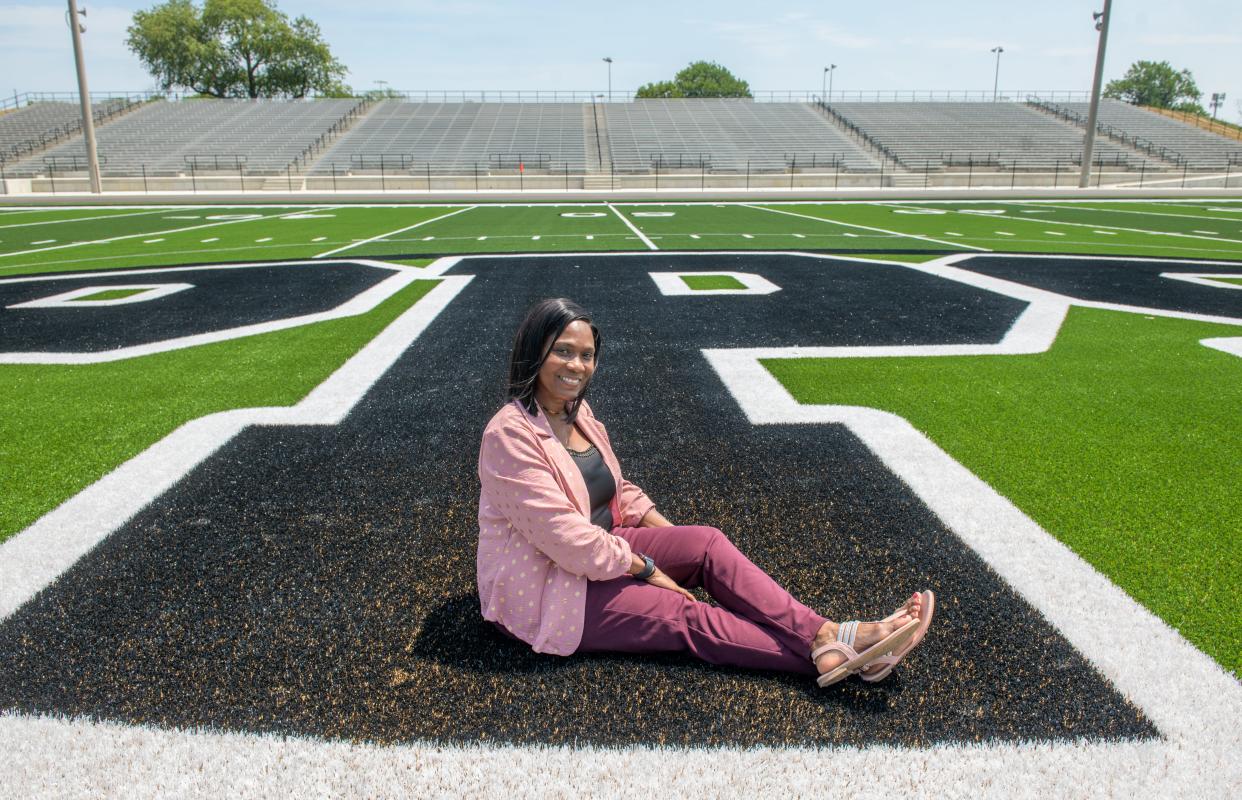 Peoria Public Schools Superintendent Dr. Sharon Desmoulin-Kherat poses on the PPS logo on the new turf of the renovated Peoria Stadium. The stadium is undergoing an $11 million-dollar renovation including new concrete visitors seating, new artificial turf on the field, a new track, an indoor sports dome in the north parking lot, and various other upgrades.