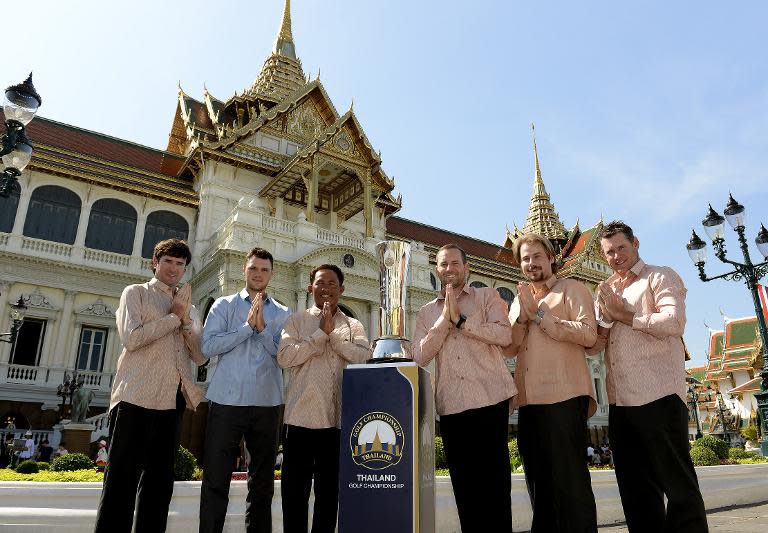 (L-R) Bubba Watson, Martin Kaymer, Thongchai Jaidee, Sergio Garcia, Victor Dubuisson and Lee Westwood with the Thailand Golf Championship trophy at the Grand Palace in Bangkok on December 9, 2014