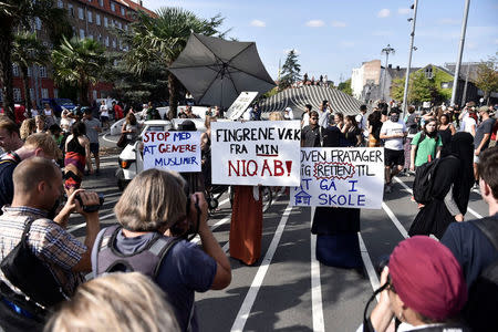 Demonstration on the first day of the implementation of the Danish face veil ban in Copenhagen, Denmark August 1, 2018. The poster in the middle reads "Keep your hands of my niqab". Mads Claus Rasmussen/Ritzau Scanpix/via REUTERS