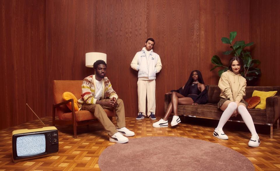 Puma’s 75th anniversary Forever Classic campaign features a backdrop that looks like a midcentury living room, with lots of warm-toned wood and carpets, and white-painted brick walls.