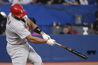 St. Louis Cardinals' Albert Pujols hits a three-run home run against the Toronto Blue Jays during the fifth inning of a baseball game Wednesday, July 27, 2022, in Toronto. (Jon Blacker/The Canadian Press via AP)