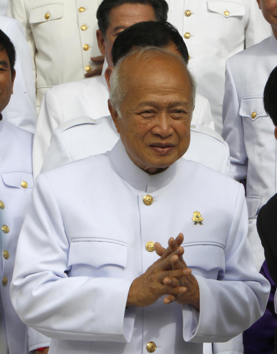 FILE - Prince Norodom Ranariddh and the royal FUNCIPEC Party walks together at the National Assembly, in Phnom Penh, Cambodia, Tuesday, Nov. 28, 2018. Ranariddh, former prime minister and the son of the late King Norodom Sihanouk, died Sunday, Nov. 28, 2021 in France, Information Minister Khieu Kanharith announced on his Facebook page. He was 77. (AP Photo/Heng Sinith, File)