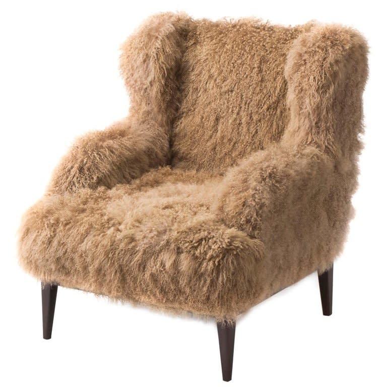 We know it's pricey, but how inviting is this Mongolian lamb fur chair?! <a rel="nofollow noopener" href="https://www.1stdibs.com/furniture/seating/wingback-chairs/masculo-wing-chair-contemporary-high-back-mongolian-furry-armchair/id-f_12251771/" target="_blank" data-ylk="slk:SHOP NOW;elm:context_link;itc:0;sec:content-canvas" class="link ">SHOP NOW</a>: Masculo Wing Chair by Mondo Collection, $7,000, 1stdibs.com