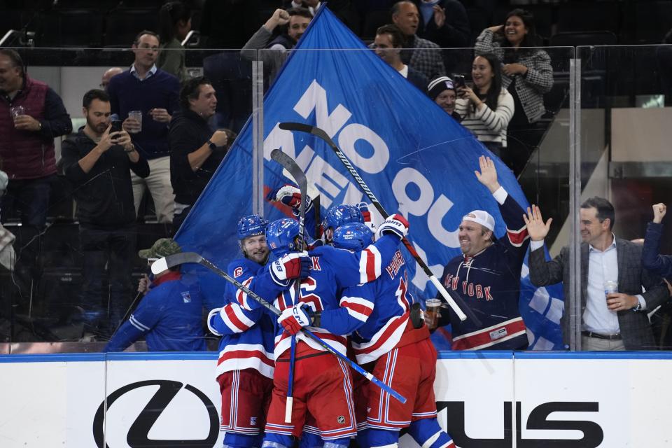 The New York Rangers celebrate a goal by Alexis Lafreniere during the third period of an NHL hockey game against the Minnesota Wild, Thursday, Nov. 9, 2023, in New York. (AP Photo/Frank Franklin II)