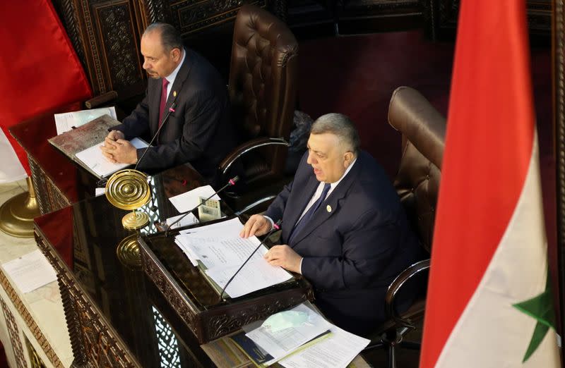 Parliament Speaker Hammouda Sabbagh heads a parliament session to discuss upcoming presidential election in Damascus