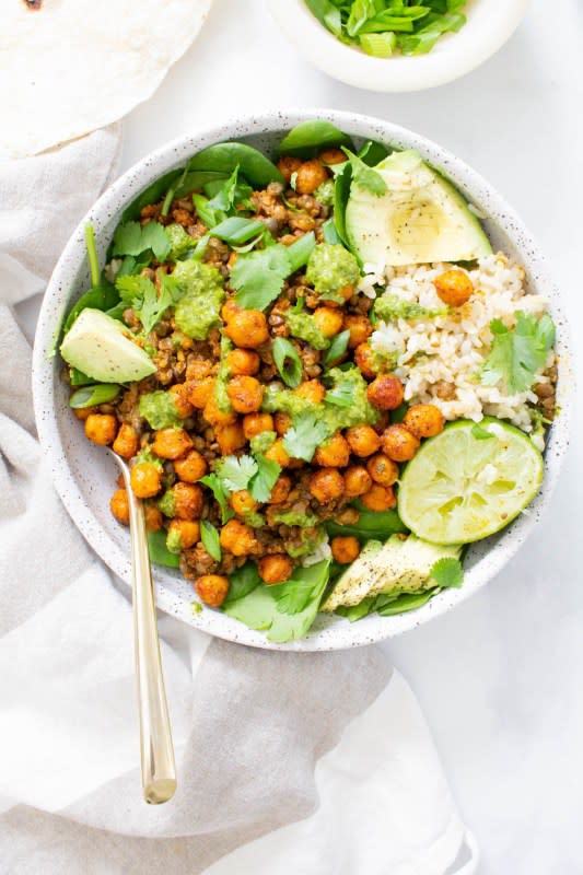 <p>This Savory Vegan</p><p>These chickpea lentil taco rice bowls are filled with brown rice, spinach, roasted chickpeas and vegan taco lentil meat. All topped off with chimichurri.</p><p><strong>Get the recipe: <a href="https://www.thissavoryvegan.com/chickpea-lentil-taco-rice-bowls/" rel="nofollow noopener" target="_blank" data-ylk="slk:Chickpea Lentil Taco Rice Bowls;elm:context_link;itc:0;sec:content-canvas" class="link ">Chickpea Lentil Taco Rice Bowls</a></strong></p>