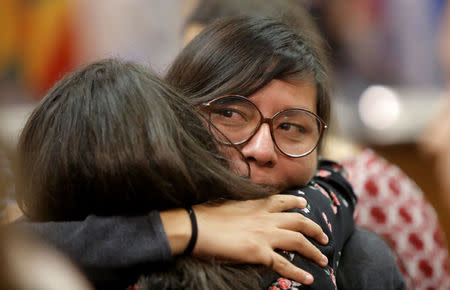 Norma Kimenez (R), a victim of the 2006 land conflict in San Salvador Atenco in Mexico, is embraced afters her hearing was convened by the judges of the Inter-American Court of Human Rights in San Jose, Costa Rica November 16, 2017. REUTERS/Juan Carlos Ulate