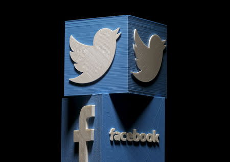 3D-printed Facebook and Twitter logos are seen in this picture illustration made in Zenica, Bosnia and Herzegovina on January 26, 2016. REUTERS/Dado Ruvic