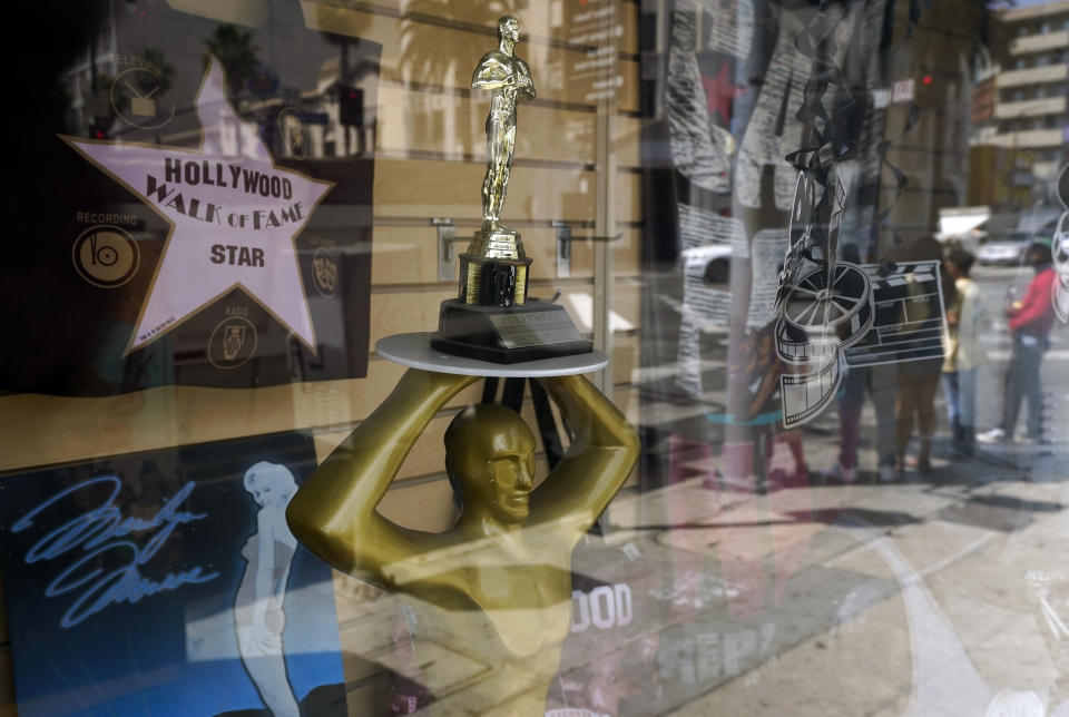 A souvenir Oscar is pictured in the window of a gift shop on Hollywood Blvd., Thursday, April 15, 2021, in Los Angeles. The 93rd Academy Awards will be held in various locations including the Dolby Theatre in Hollywood on Sunday, April 25. (AP Photo/Chris Pizzello)