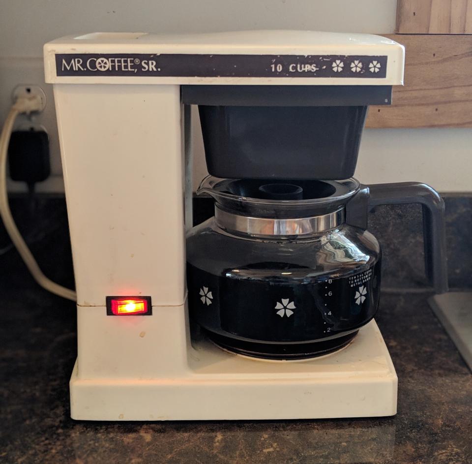 A white Mr Coffee maker with just one button