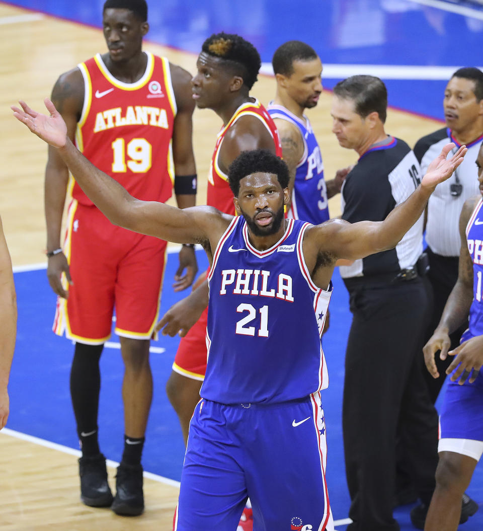 Philadelphia 76ers center Joel Embiid fires up the fans after going face to face with Atlanta Hawks center Clint Capela in Game 5 of an NBA basketball Eastern Conference semifinal Wednesday, June 16, 2021, in Philadelphia. (Curtis Compton/Atlanta Journal-Constitution via AP)