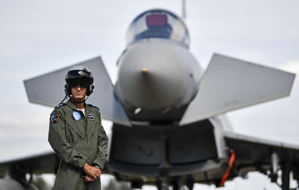 A pilot from Israel stands in front of a Eurofighter at the airbase in Noervenich, Germany, Thursday, Aug. 20, 2020. Pilots from Israel and Germany will fly together the next two weeks during the first joint military Air Force exercises between the two nations in Germany. (AP Photo/Martin Meissner)