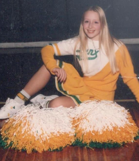 The author as a teen in 1995, in her Lincoln Lynx cheerleader uniform. 