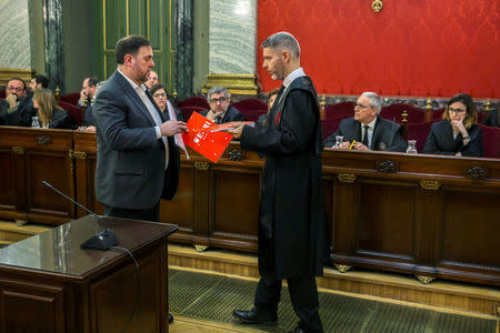 Catalan separatist leader Oriol Junqueras gets documents from his lawyer Andreu van den Eynde at the start of their trial at Supreme Court in Madrid, Spain, February 12, 2019. Emilio Naranjo/Pool via REUTERS