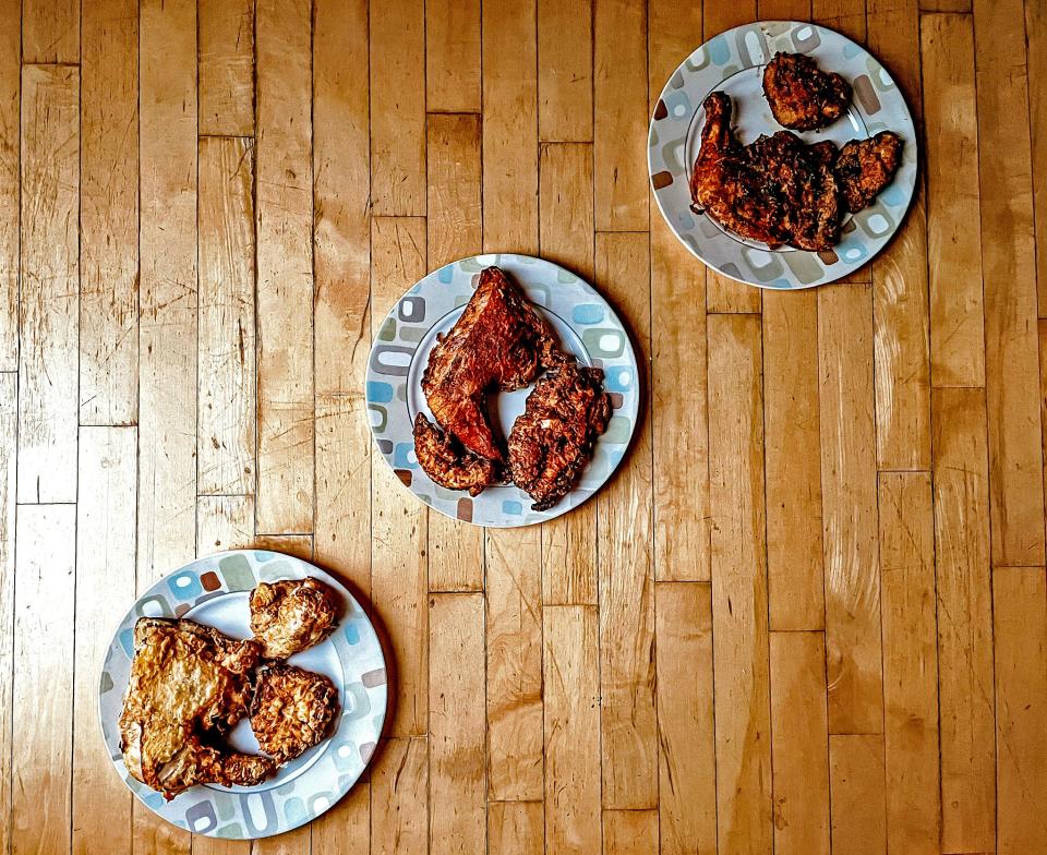 three plates of fried chicken on a diagonal