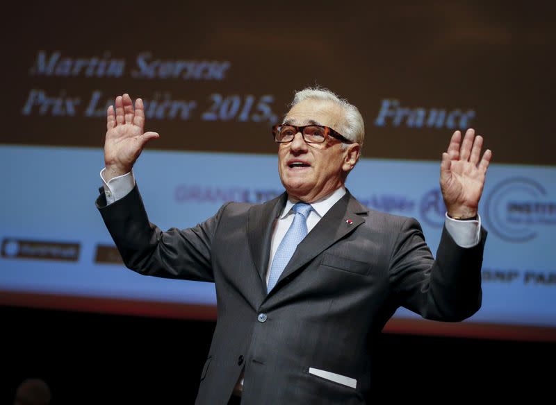 FILE PHOTO: U.S. filmmaker Scorcese waves on stage after beeing awarded during the 2015 Lumiere Grand Lyon film festival in Lyon