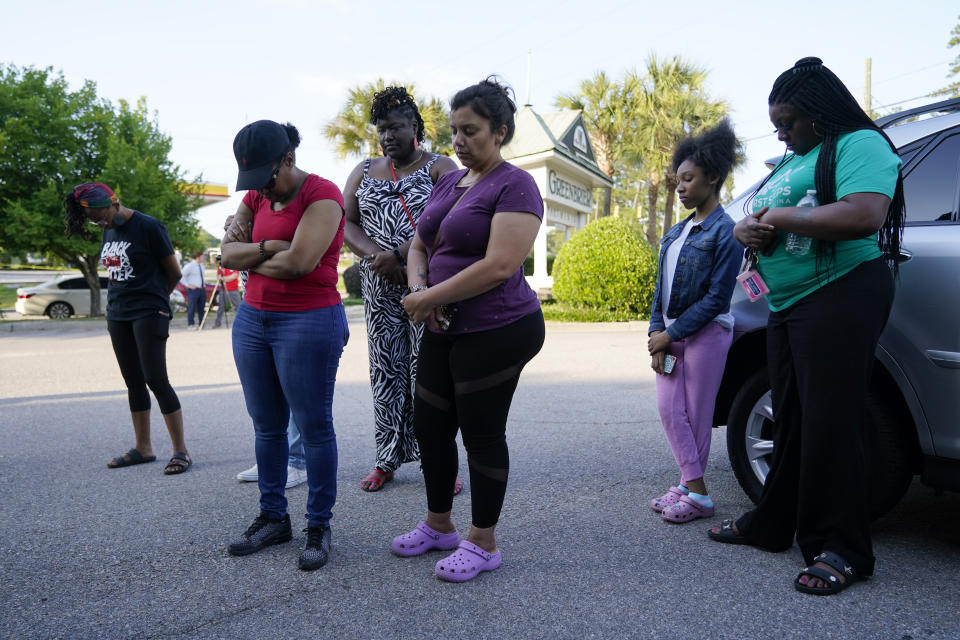 People participate during a prayer vigil in remembrance of Cyrus Carmack-Belton, Friday, June 2, 2023, in Columbia, S.C. Authorities say Carmack-Belton, 14, was fatally shot in the back by a South Carolina gas station owner, who he wrongly suspected of stealing four water bottles. (AP Photo/Erik Verduzco)