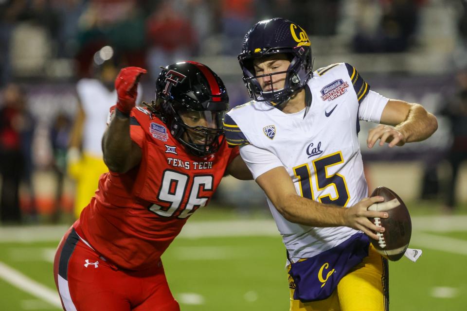 Texas Tech defensive end Amier Washington (96) left closes in on California quarterback Fernando Mendoza (15) during the Red Raiders' 34-14 victory on Dec. 16 at the Independence Bowl. It was only the second career game for Washington, who was credited with four tackles for loss, including two sacks.
