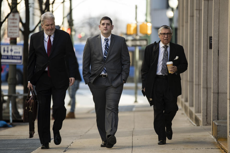 Former East Pittsburgh police officer Michael Rosfeld, center, charged with homicide in the shooting death of Antwon Rose II, arrives at the Dauphin County Courthouse in Harrisburg, Pa., Tuesday, March 12, 2019. (AP Photo/Matt Rourke)