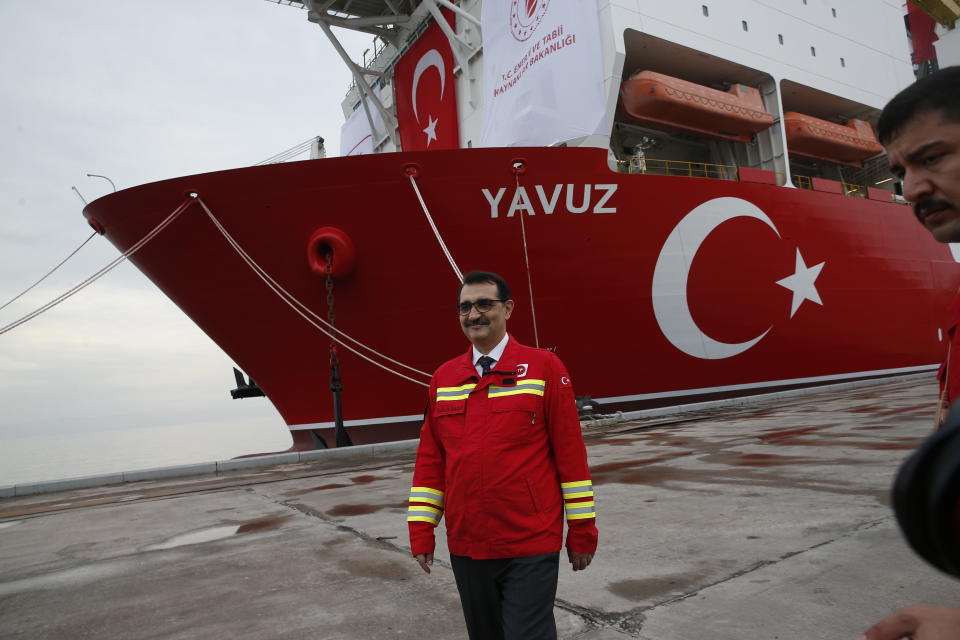 Turkish Energy and Natural Resources Minister Fatih Donmez poses for photographs after visiting the 230-meter (750-foot) drilling ship 'Yavuz' scheduled to be dispatched to the Mediterranean, at the port of Dilovasi, outside Istanbul, Thursday, June 20, 2019. Turkey is launching a second drillship that it says will drill for gas off neighbouring Cyprus despite European Union warnings to refrain from such illegal actions that could incur sanctions against Ankara. (AP Photo/Lefteris Pitarakis)