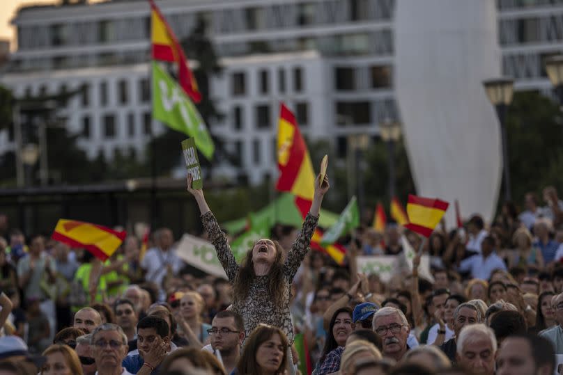 VOX far right supporters wave during the closing campaign rally at the Colon square in Madrid, July 2023