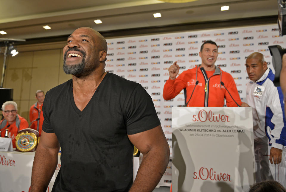 Former heavyweight world champion Shannon Briggs of the United States, left, shows up at a press conference of boxer Wladimir Klitschko of Ukraine, right, during a press conference ahead of Klitschko's IBF, IBO, WBO and WBA heavyweight title bout against challenger Alex Leapai from Australia-Samoa in Duesseldorf, Germany, April 22, 2014. Briggs demanded a title fight against Klitschko in the US. (AP Photo/Martin Meissner)