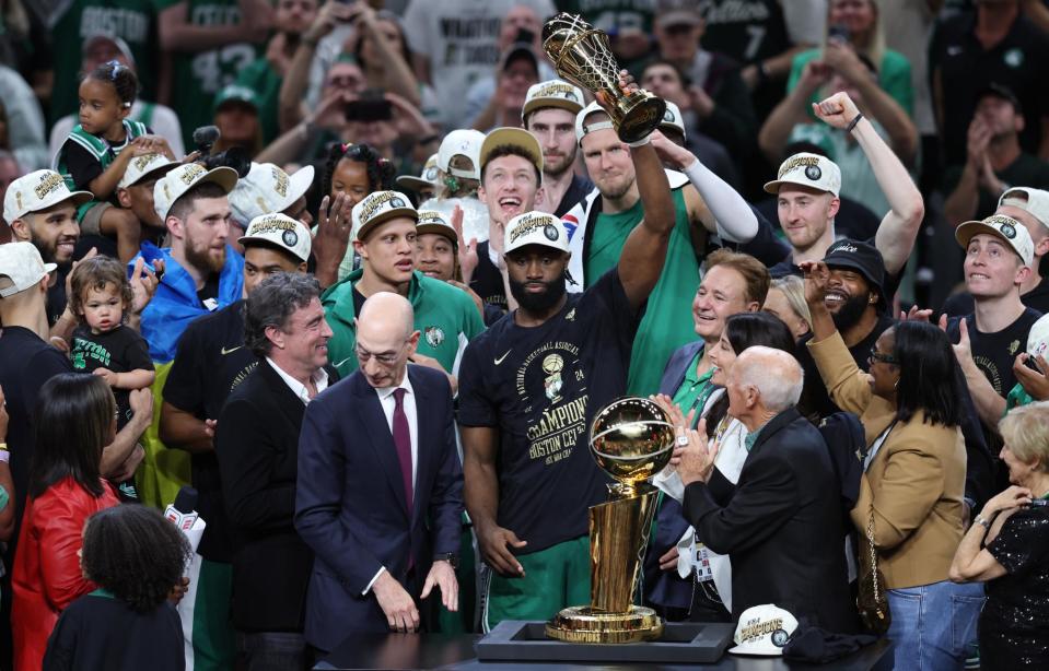 <span>The <a class="link " href="https://sports.yahoo.com/nba/teams/boston/" data-i13n="sec:content-canvas;subsec:anchor_text;elm:context_link" data-ylk="slk:Boston Celtics;sec:content-canvas;subsec:anchor_text;elm:context_link;itc:0">Boston Celtics</a> celebrate their record 18th NBA championship.</span><span>Photograph: Adam Glanzman/Getty Images</span>