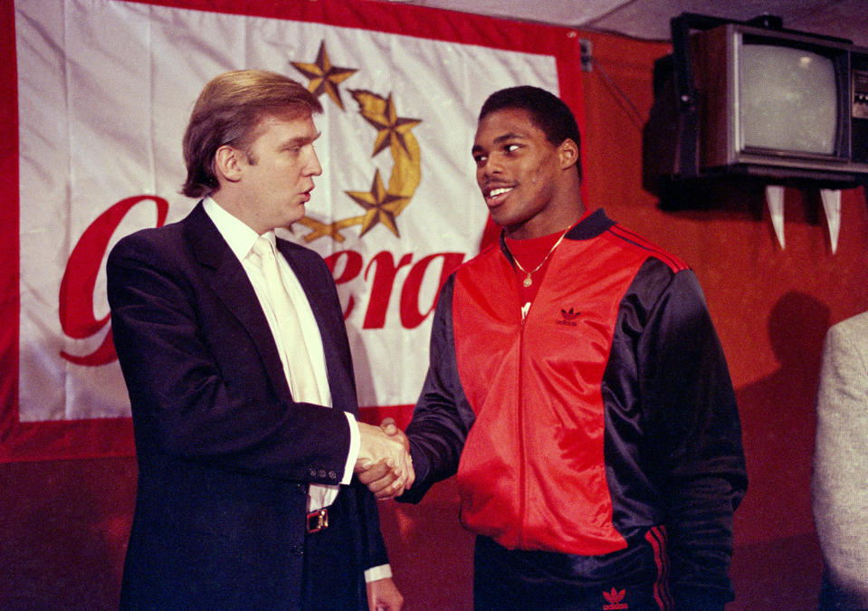Donald Trump shakes hands with Herschel Walker in New York after agreement on a 4-year contract with the New Jersey Generals USFL football team on March 8, 1984. The New Jersey Generals have been largely forgotten, but Trump’s ownership of the team was formative in his evolution as a public figure and peerless self-publicist. With money and swagger, he led a shaky and relatively low-budget spring football league, the USFL, into a showdown with the NFL. (Photo: Dave Pickoff/AP)