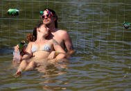 <p>Festivalgoers cool themselves in the Danube River during the Sziget music festival on an island in Budapest, Hungary, Aug. 9, 2018. (Photo: Bernadett Szabo/Reuters) </p>