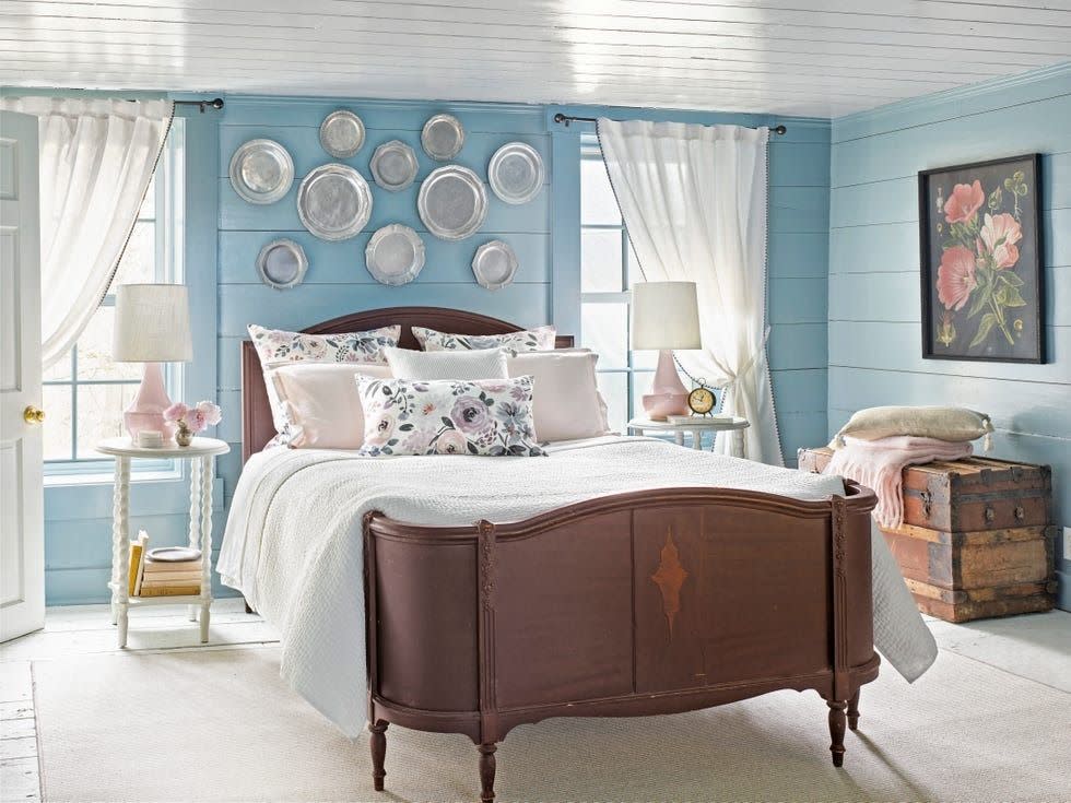 blue farmhouse bedroom with wood bed