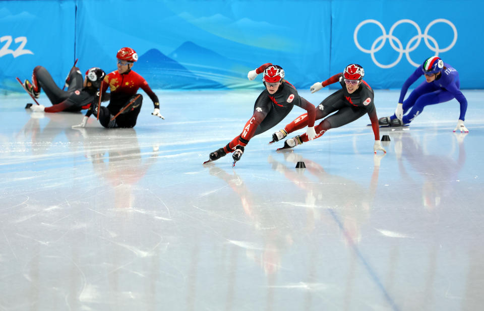 Kim Boutin and Florence Brunelle lead the race as Kexin Fan and Alyson Charles crash.