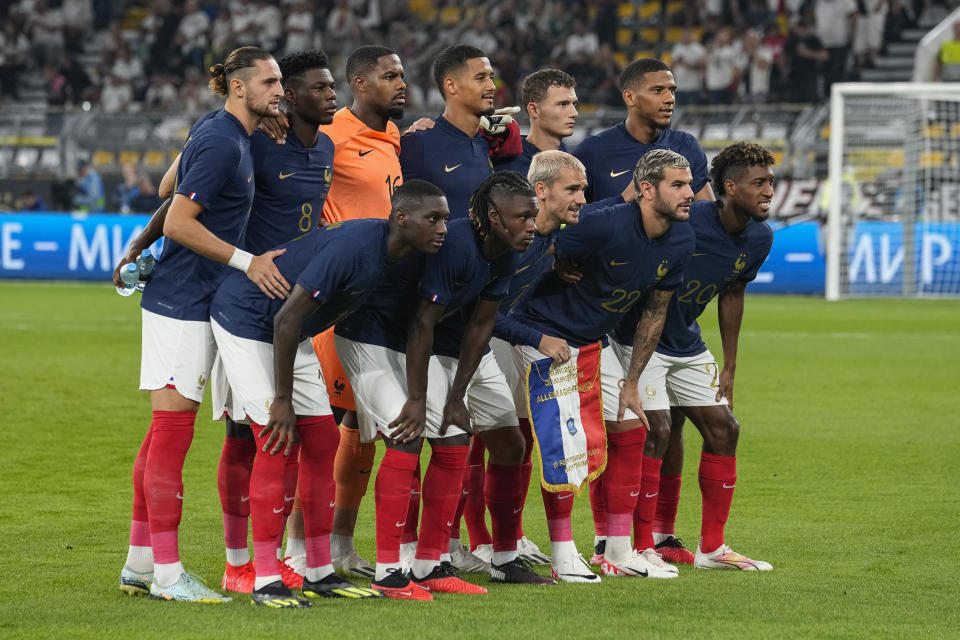 FILE - France's players pose for photographers before the international friendly soccer match between Germany and France in Dortmund, Germany, on Sept. 12, 2023. For Muslim soccer players in deeply secular France, observing Ramadan is a tall order. Wielding a principle of religious neutrality enshrined in the French constitution, the country's soccer federation does not accomodate players who want to fast and refrain from drinking or eating from sunrise to sunset. (AP Photo/Martin Meissner, File)