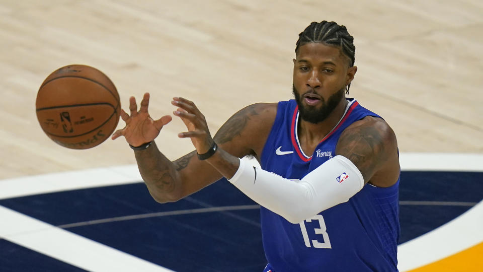 Los Angeles Clippers guard Paul George receives a pass during the first half of the team's NBA basketball game against the Utah Jazz on Friday, Jan. 1, 2021, in Salt Lake City. (AP Photo/Rick Bowmer)