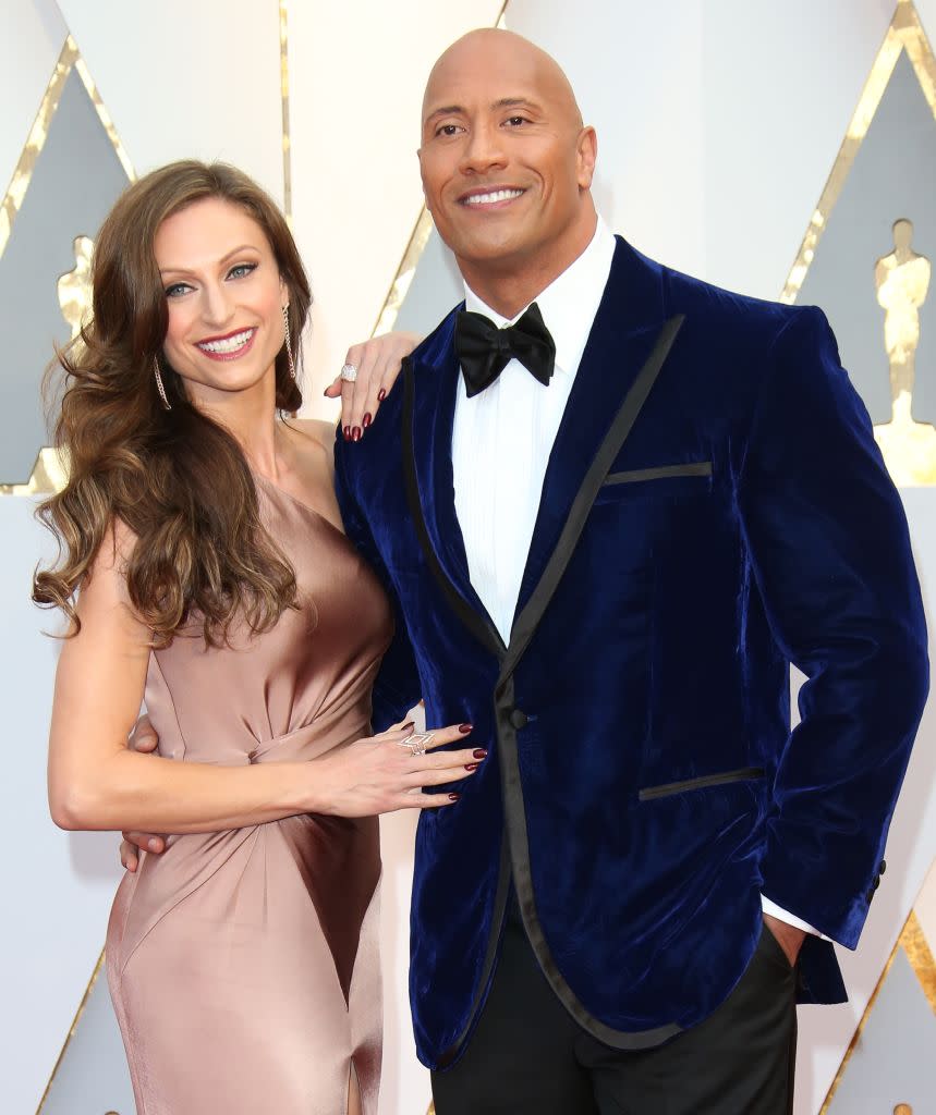 Dwayne “The Rock” Johnson and Lauren Hashian attend the 2017 Oscars. (Photo: Dan MacMedan/Getty Images)